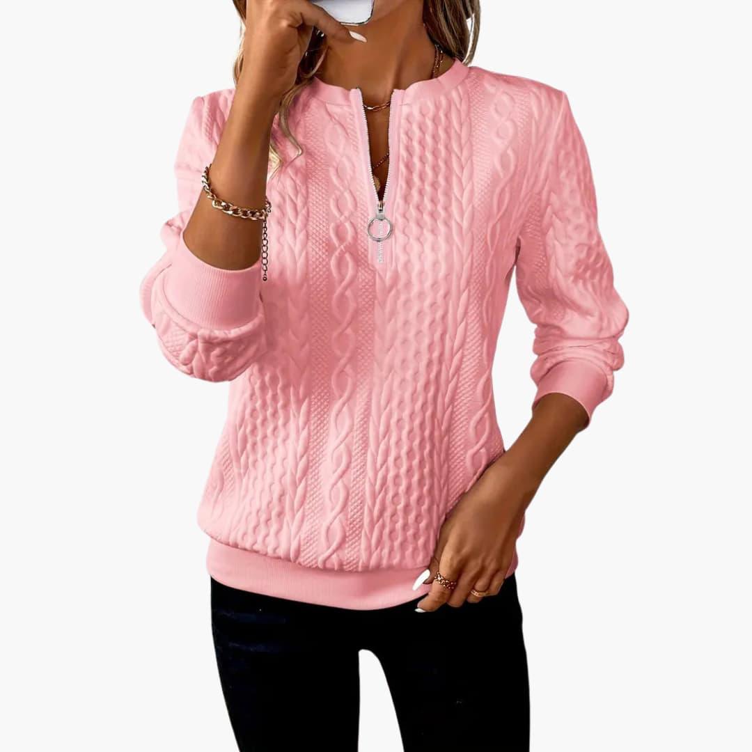 Women's pullover with zipper at the neckline and cable knit surface