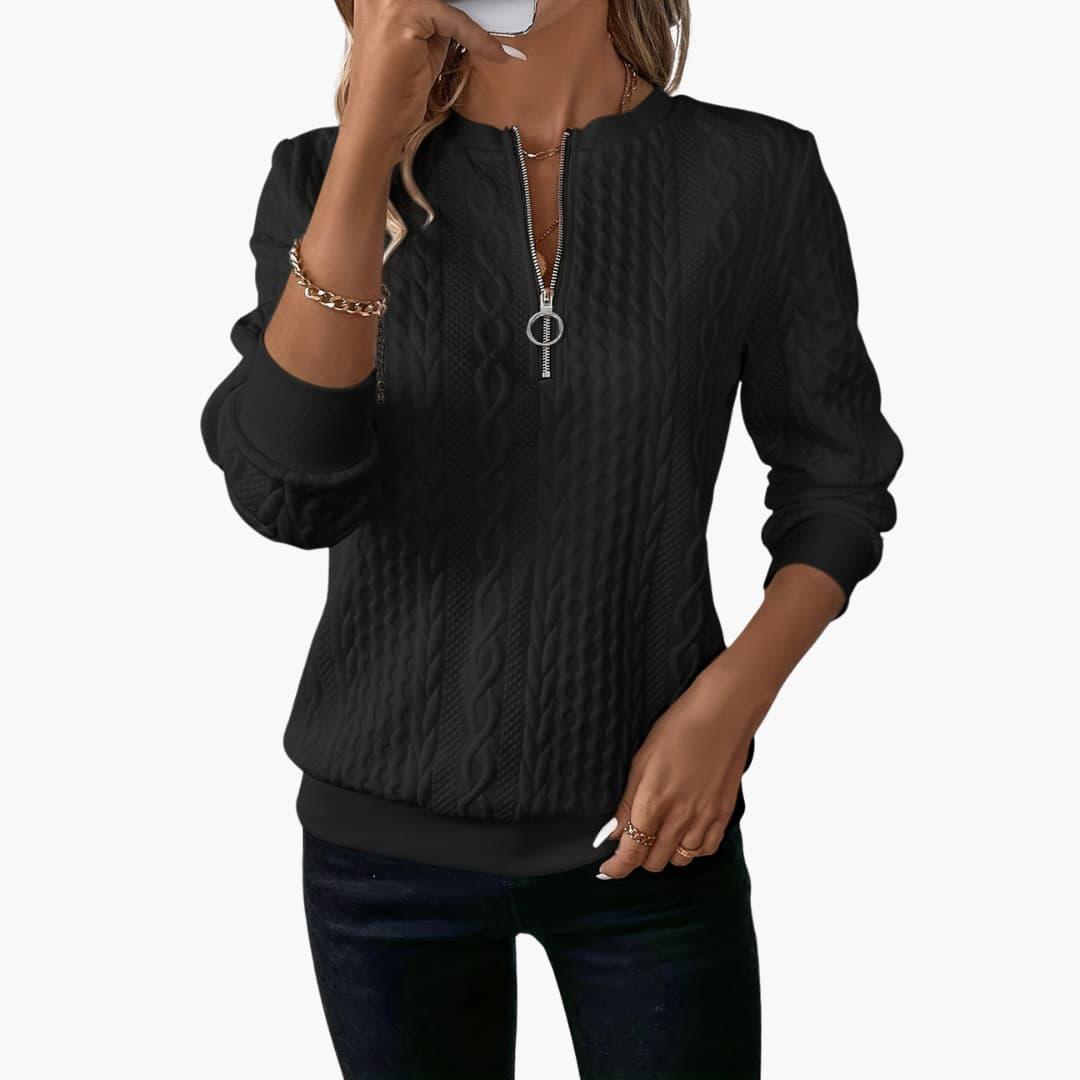Women's pullover with zipper at the neckline and cable knit surface
