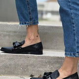 Black loafer with shiny bow